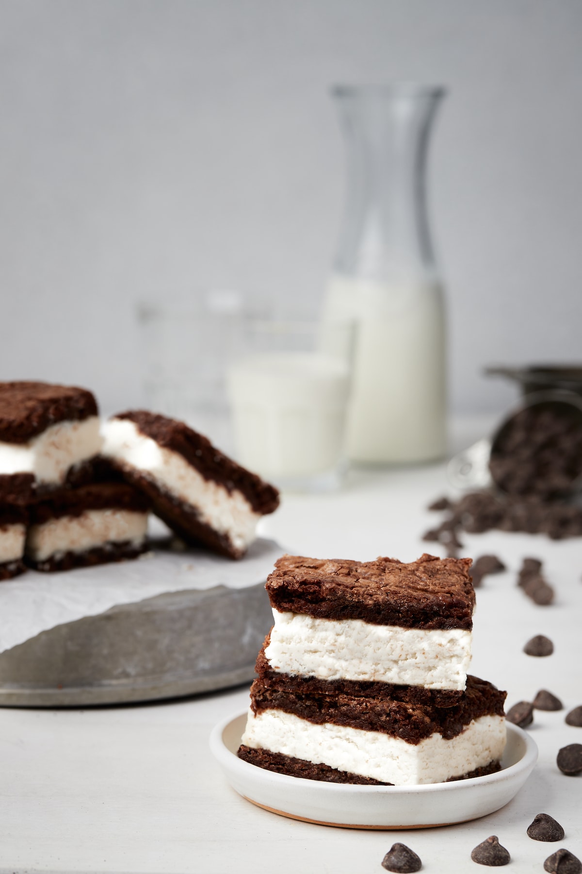 Oreo cream filled brownies with a glass of milk in the background.