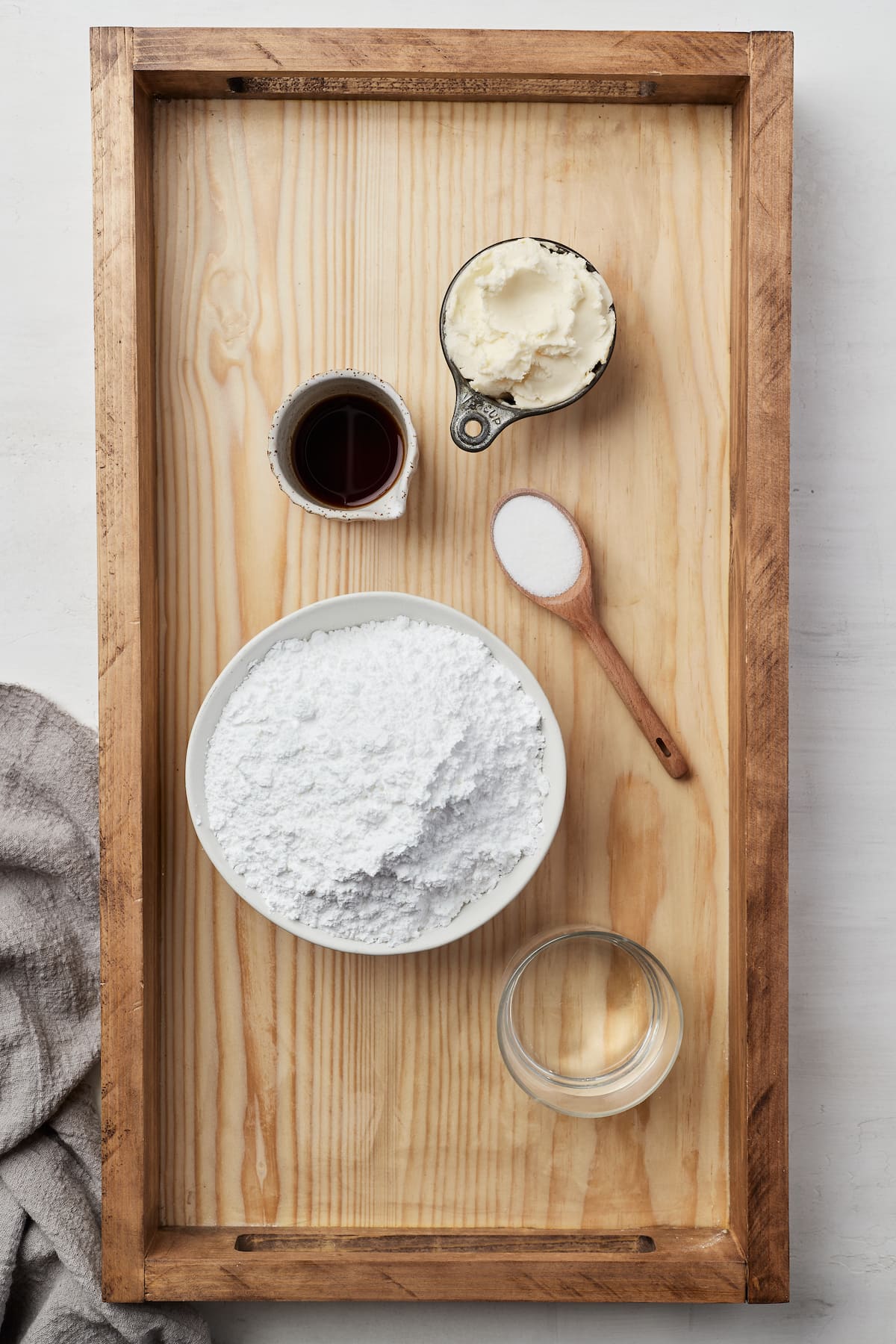 The ingredients for Oreo cream filled brownies arranged on a wooden tray.