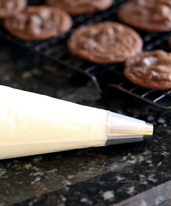 Frosting the hi hat cookies