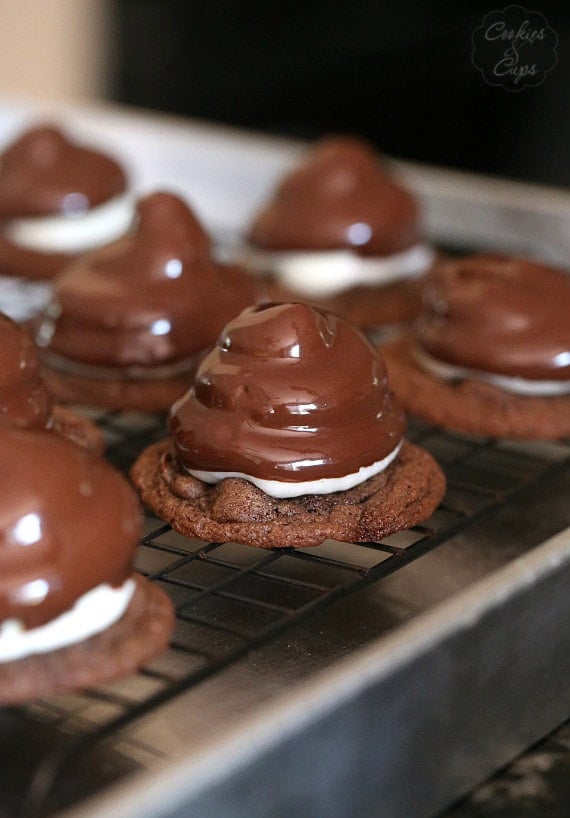 Hi Hat Cookies.. a chewy chocolate chip cookie topped with a swirl of frosting, dipped in chocolate coating.