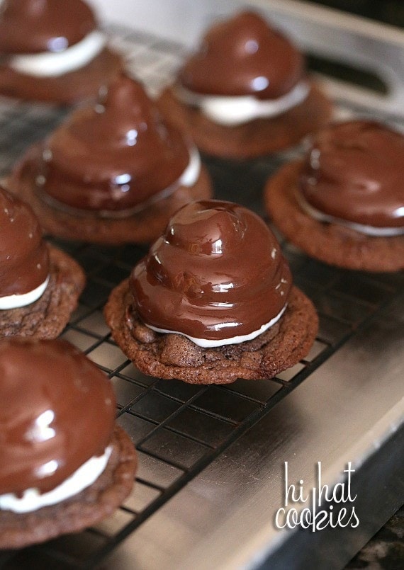 Hi Hat Cookies.. a chewy chocolate chip cookie topped with a swirl of frosting, dipped in chocolate coating. A fun spin on the classic cupcake!