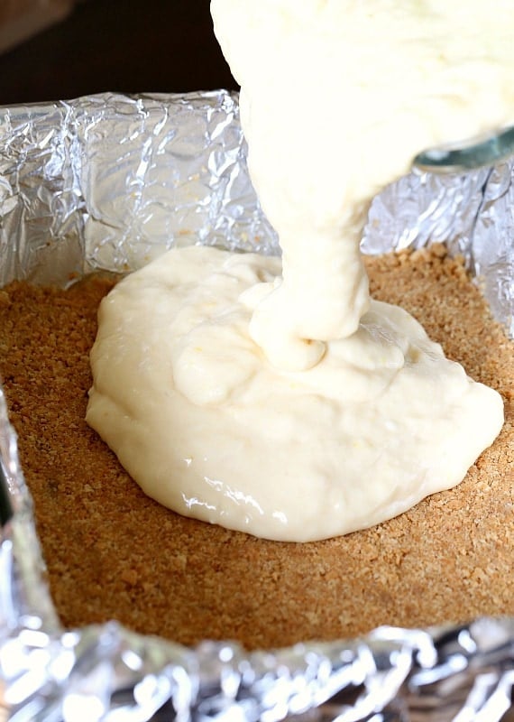 Pouring the lemon mixture into the graham crust!