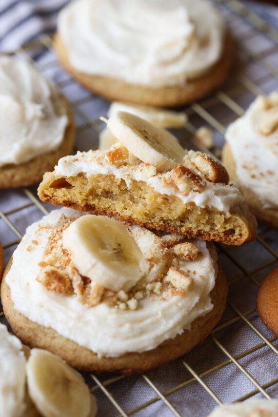 A banana pudding cookie broken in half on a wire rack