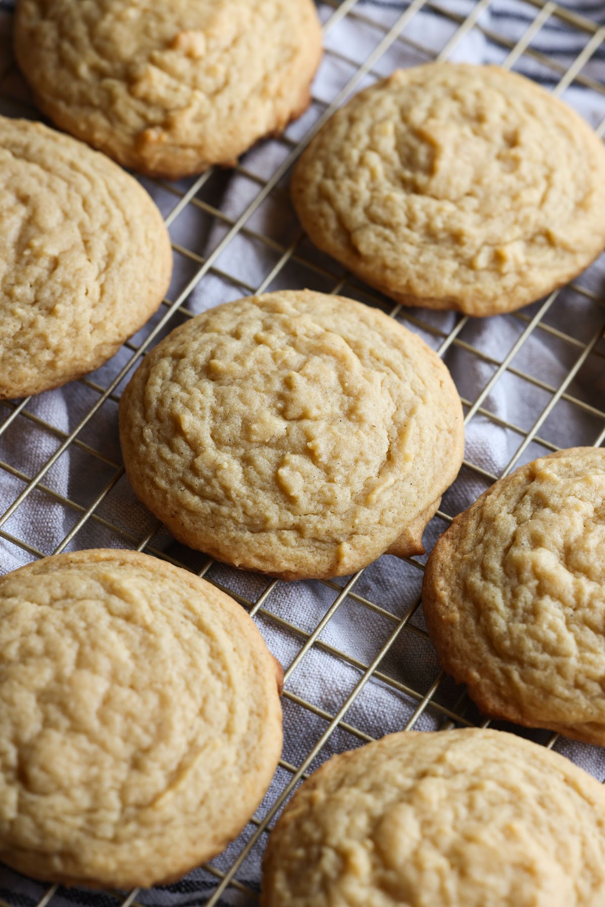 Banana pudding cookies baked and cooling on a wire rack