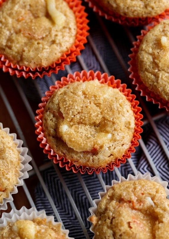 Carrot Cake muffin in a cupcake liner on a wire cooling rack