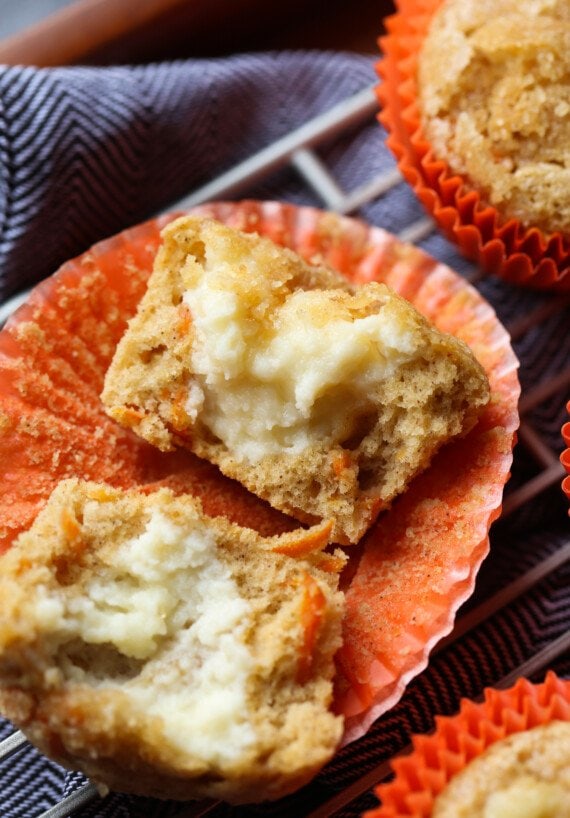 Carrot Muffin broken in half showing the cream cheese filling