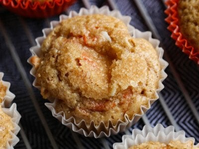 Carrot Cake Muffins on a cooling rack topped with crunchy sugar