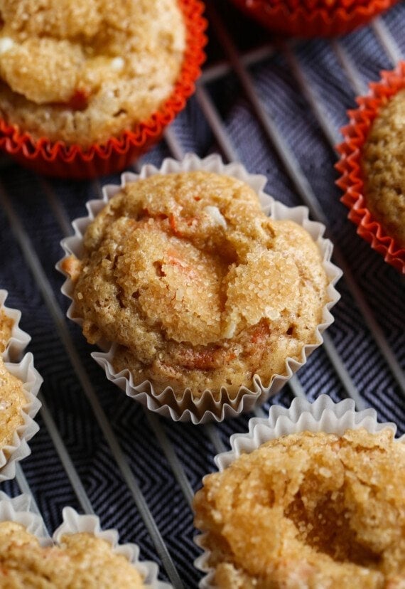 Carrot Cake Muffins on a cooling rack topped with crunchy sugar