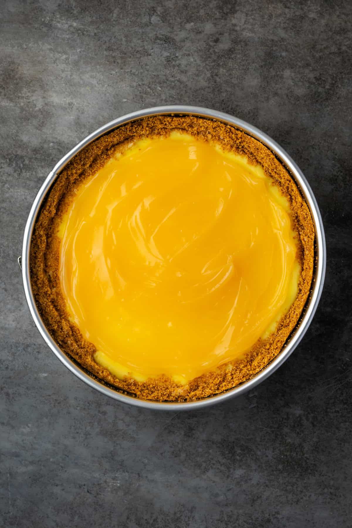 This zesty lemon meringue cheesecake has a smooth and creamy lemon filling, buttery graham cracker crust, and pillows of homemade meringue! Lemon cheesecake topped with lemon curd.