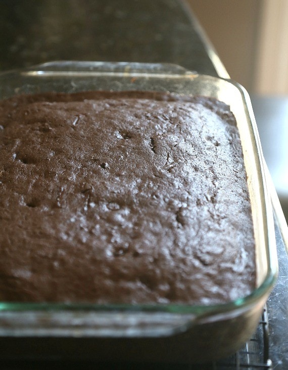 Baked chocolate zucchini cake in a glass baking dish.
