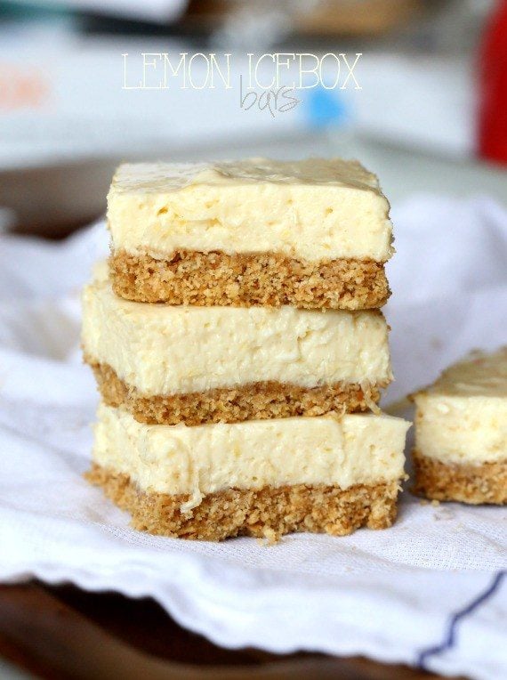 A stack of Lemon Icebox Bars with graham cracker crust