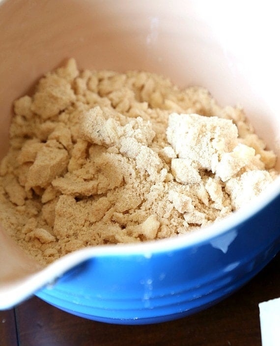 Crumble topping combined in a blue bowl.