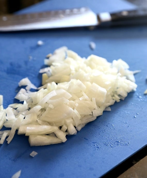 Close-up of diced onion on a cutting board