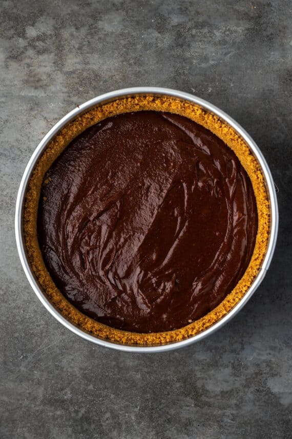 A graham cracker crust filled with brownie pie filling.