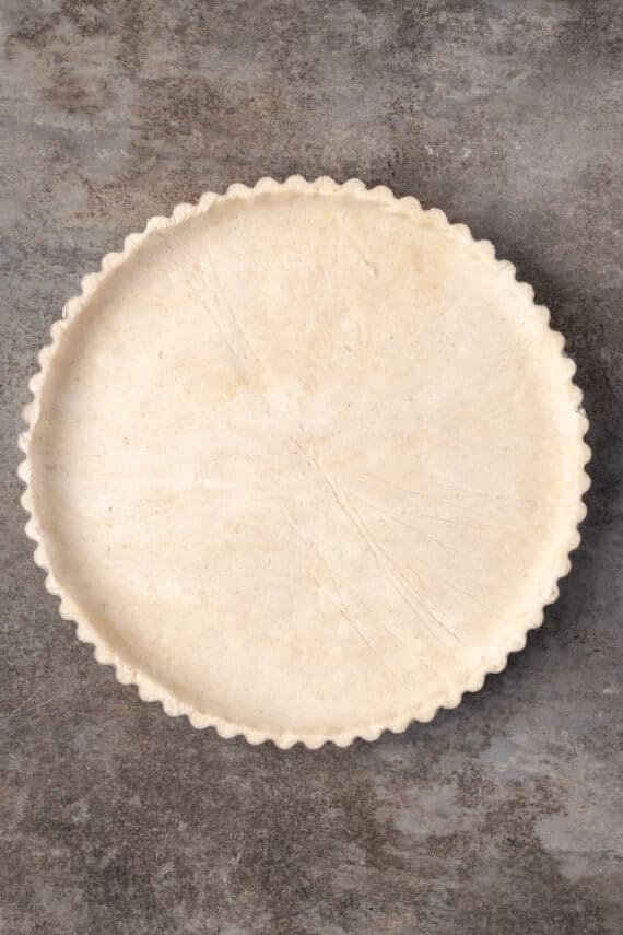 Pie crust pressed into a tart pan.