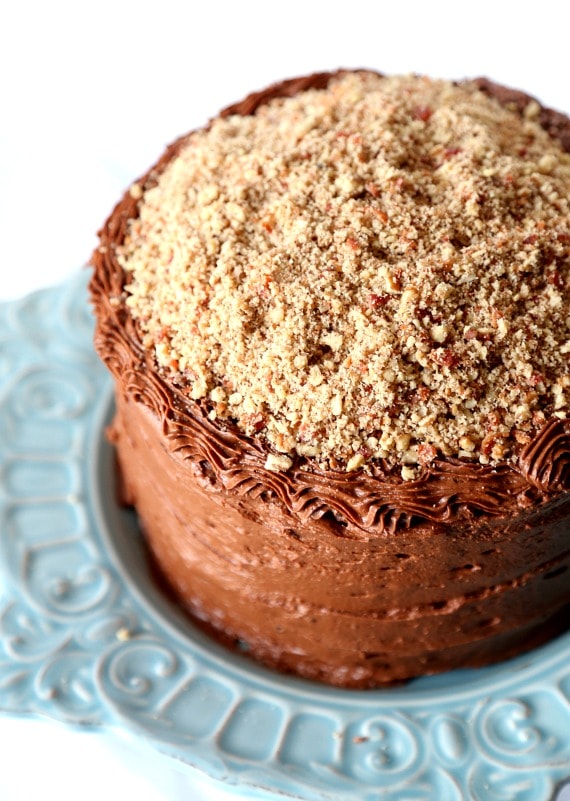 Bacon Pecan Crumble Chocolate Cake. This cake is EPIC! Super soft chocolate cake, delicious chocolate frosting and topped with a thick layer of caramel and salty bacon pecan crumble!! CRAZY GOOD!!