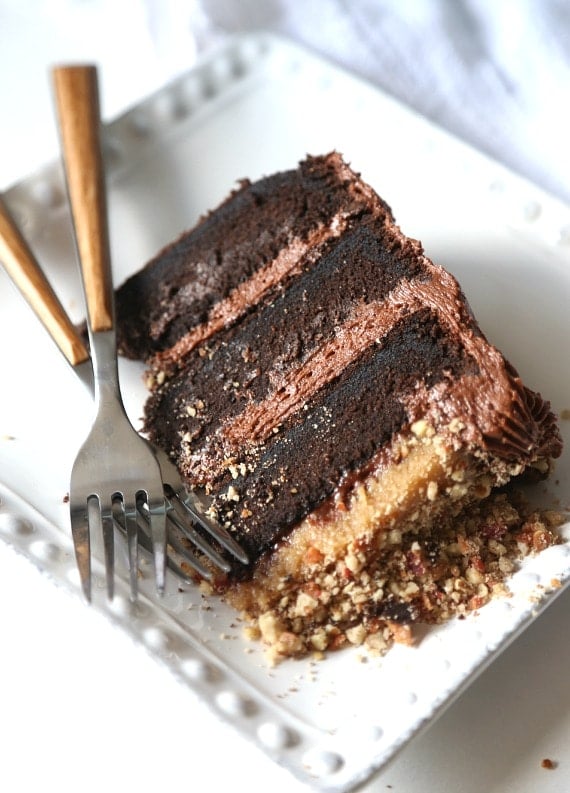 Bacon Pecan Crumble Chocolate Cake. This cake is EPIC! Super soft chocolate cake, amazing frosting and topped with a thick layer of caramel and salty bacon pecan crumble!! CRAZY GOOD!!