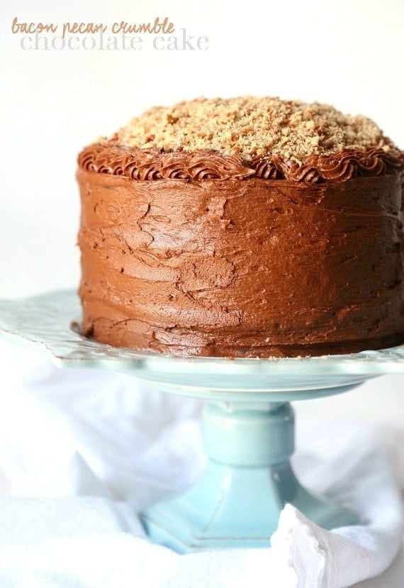 Bacon Pecan Crumble Chocolate Cake...This cake is EPIC! Such soft chocolate cake, amazing frosting and topped with a thick layer of caramel and salty bacon pecan crumble!! CRAZY GOOD!!