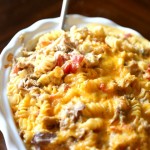 Pulled pork mac and cheese in a ceramic baking dish.