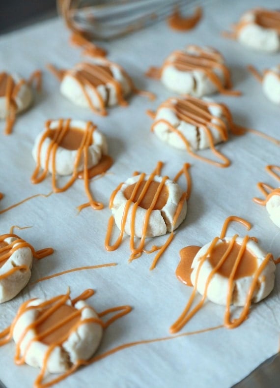Butterbeer Cookies...A buttery shortbread Meltaway base topped with a creamy Butterscotch Ganache! Tastes like the perfect little bite of Harry Potter's Butterbeer!