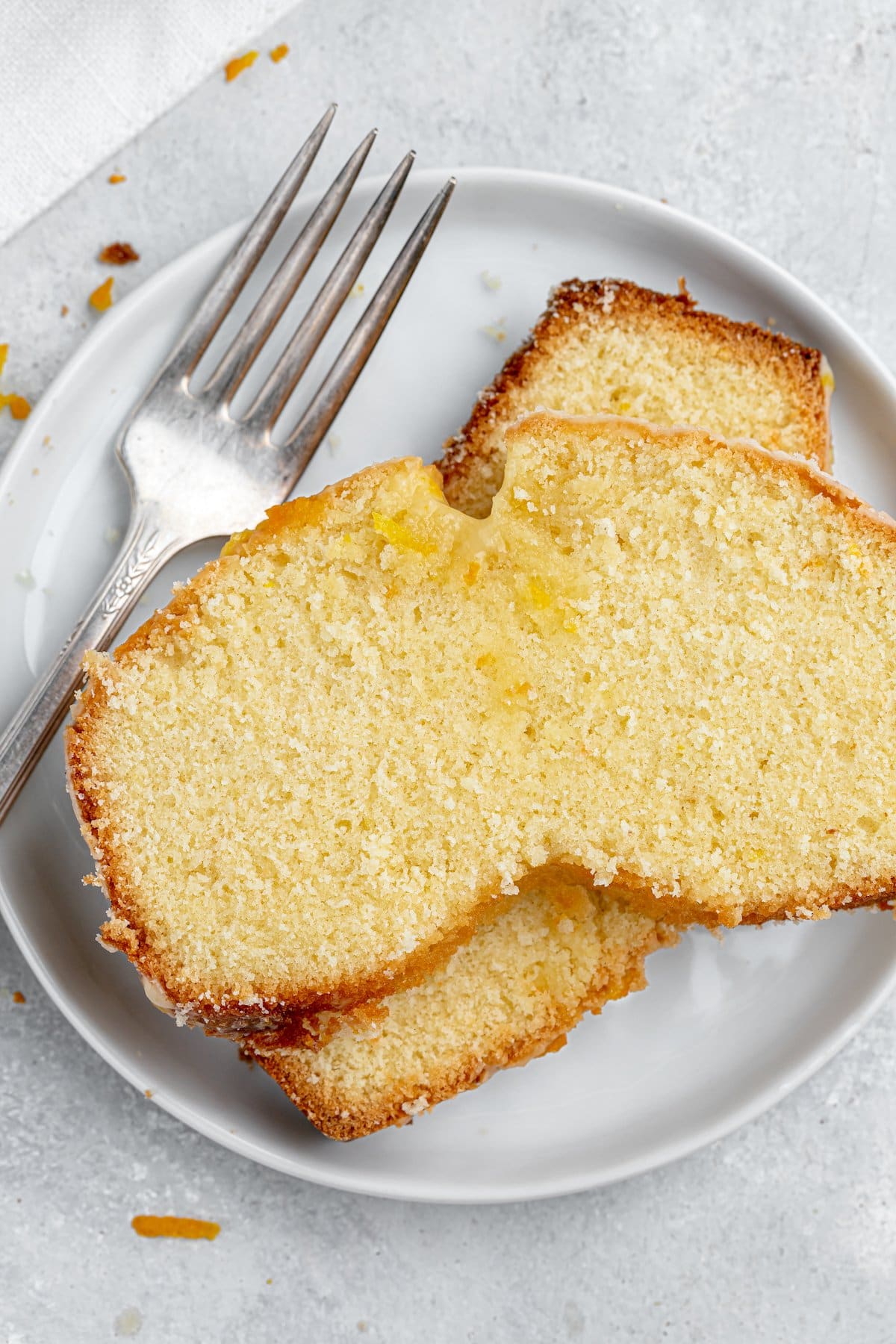 Two slices of pound cake on a plate.
