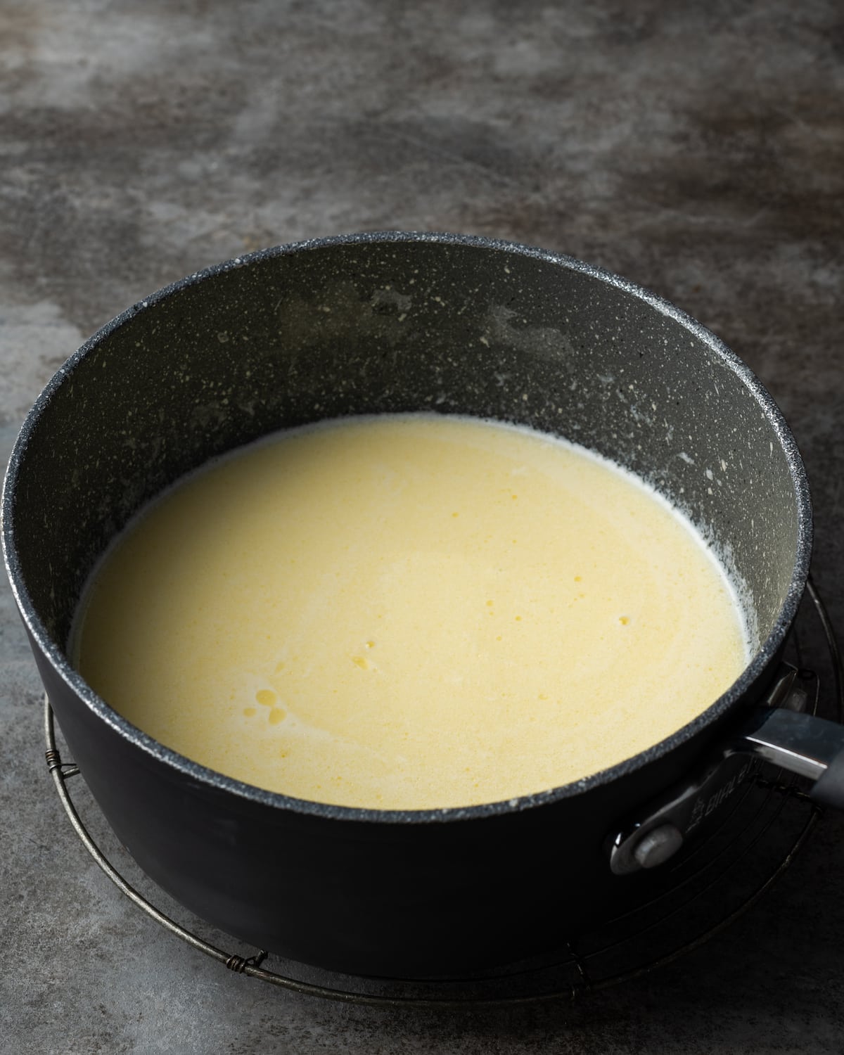 Alfredo sauce in a saucepan.