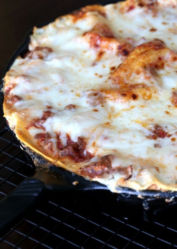 Close up of skillet lasagna in a cast iron skillet.