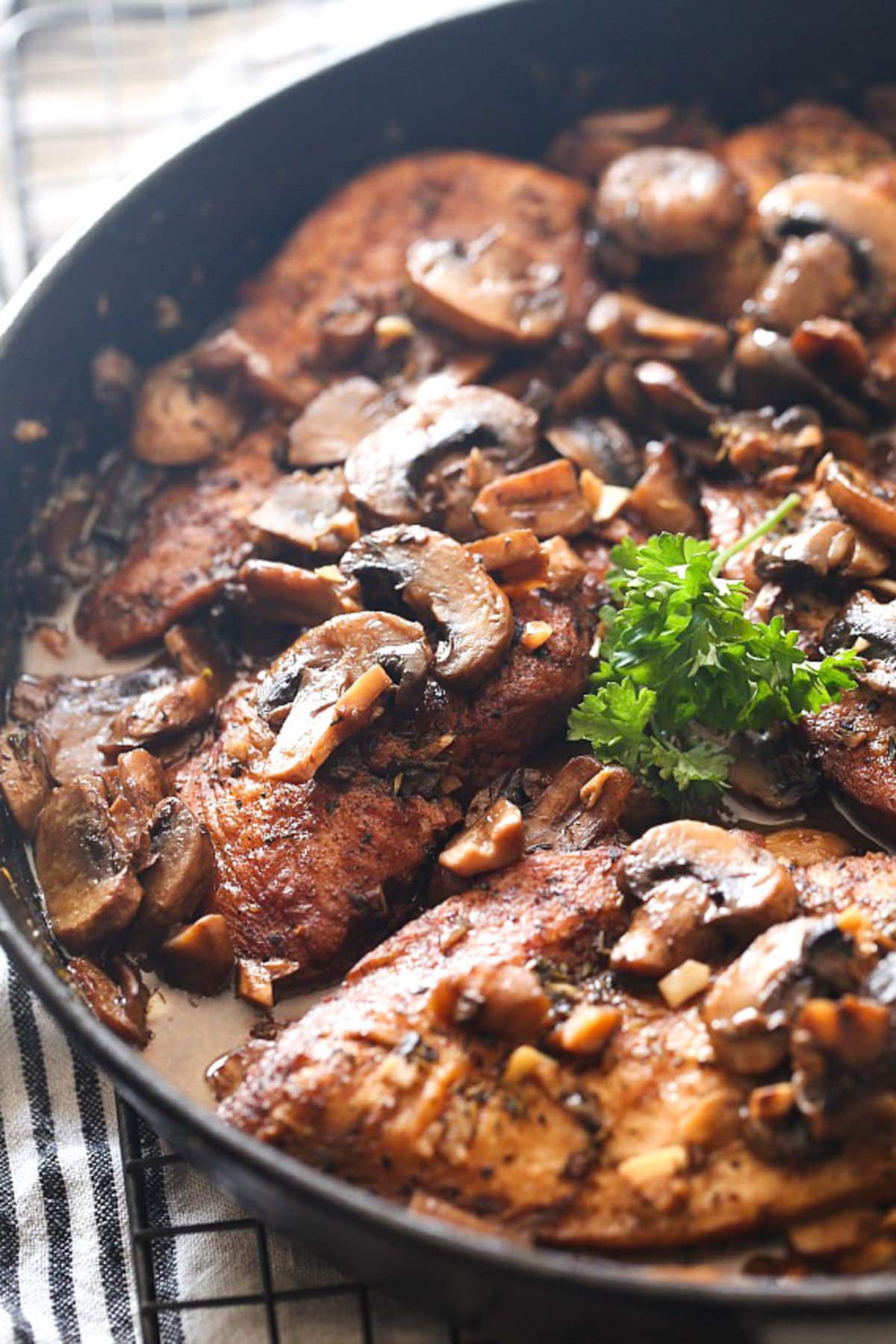 Balsamic chicken topped with a garnish