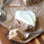 A square of frosted oatmeal cake with a bite on a fork