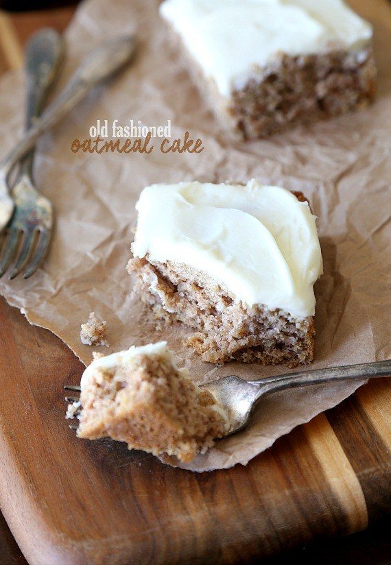 A square of frosted oatmeal cake with a bite on a fork