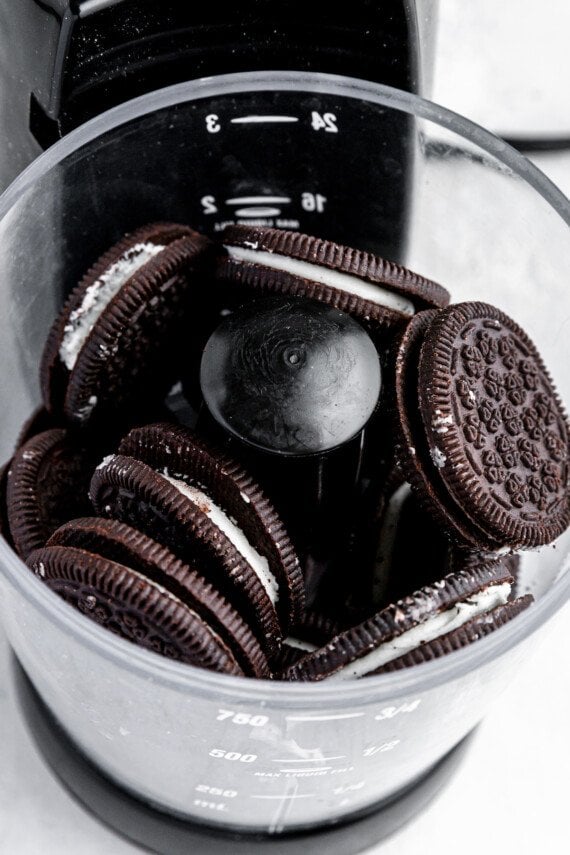 Oreo cookies in a food processor.