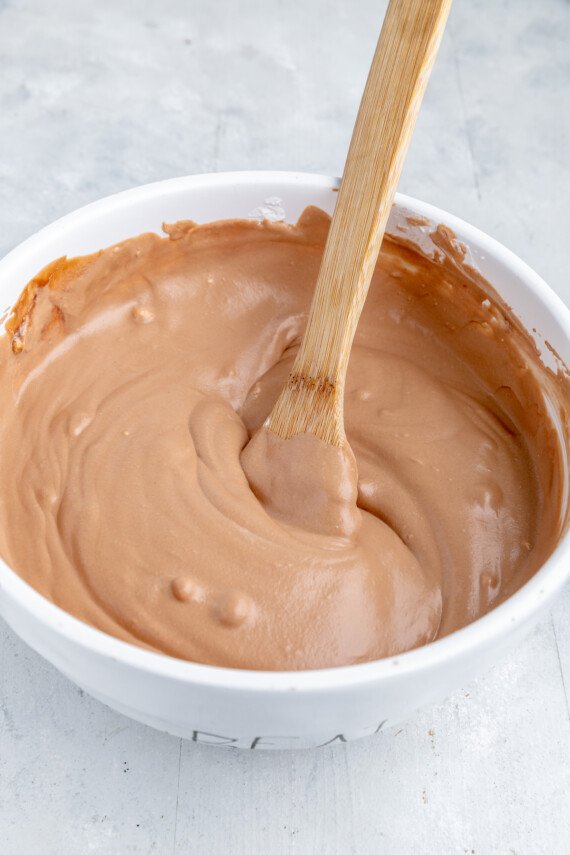 Chocolate, marshmallow, and heavy cream mixture in a bowl.
