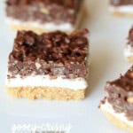 Gooey Crispy Ritz S'mores Bars! These are so crazy delicious...AND they are no bake! The creamy Fluff in between a layer of crispy, buttery Ritz Crackers and Crunchy peanut butter chocolate!