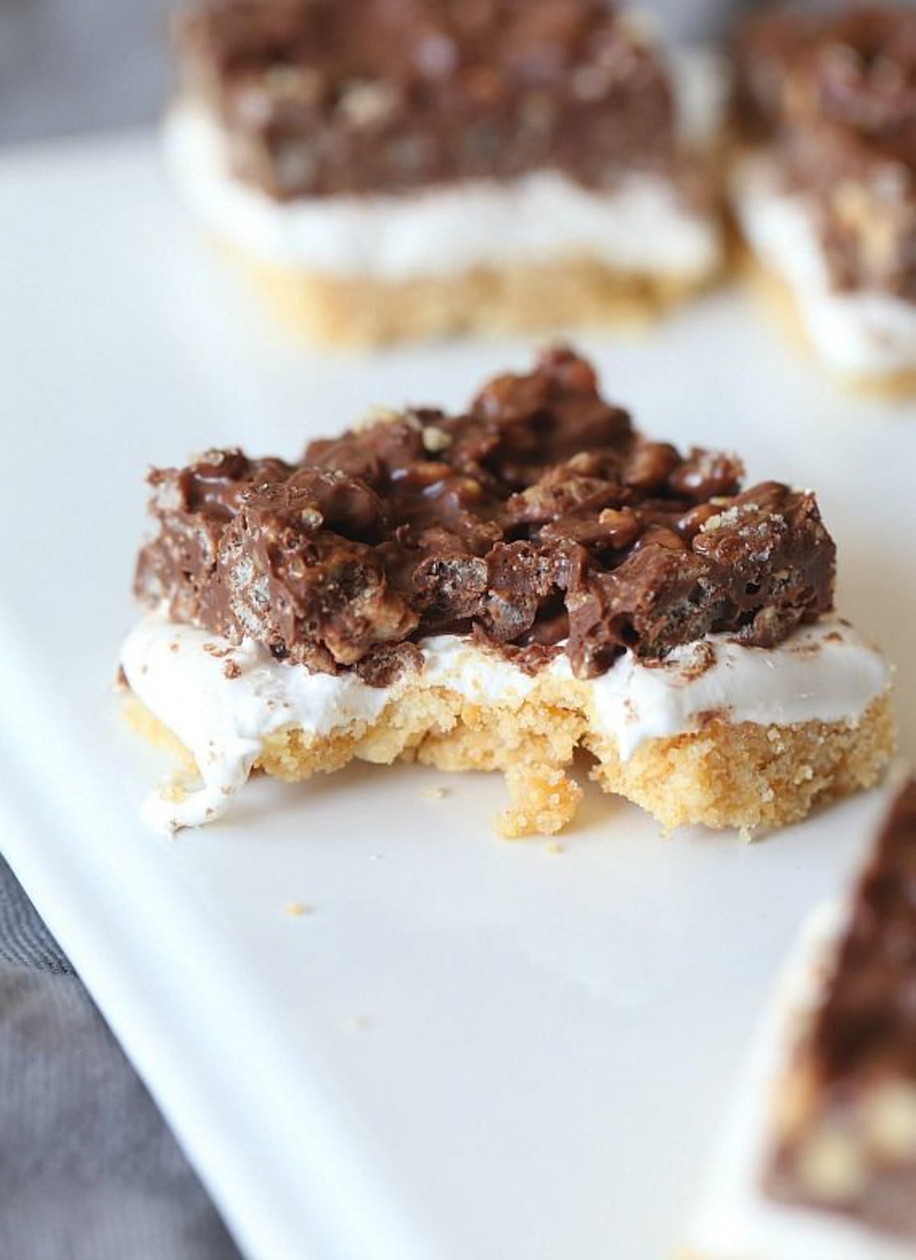 Crispy Ritz Smores bars with a bite taken out of it