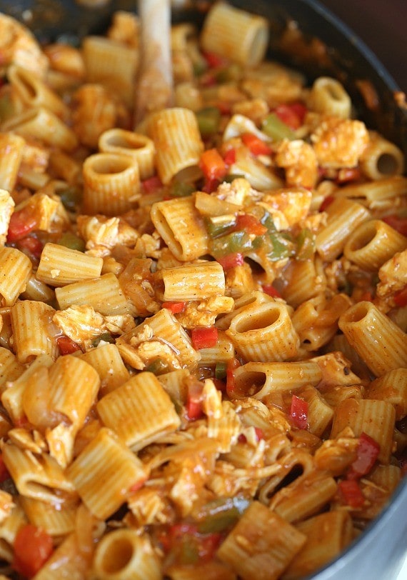 This easy Chicken Enchilada Pasta can be made in under 30 minutes if you use a Rotisserie Chicken!! It's loaded with flavor, spice and will feed a crowd!