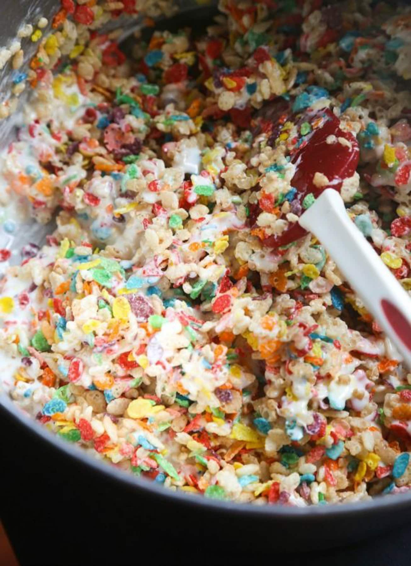 Overhead view of Krispie Treats with fluff being mixed in a bowl