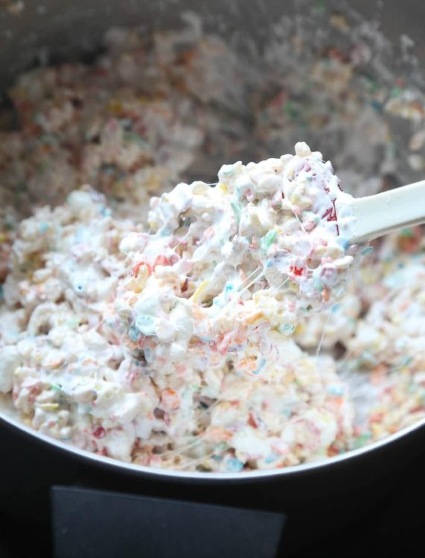 Mixture of Krispie Treats made with Fluff and mini marshmallows in a bowl