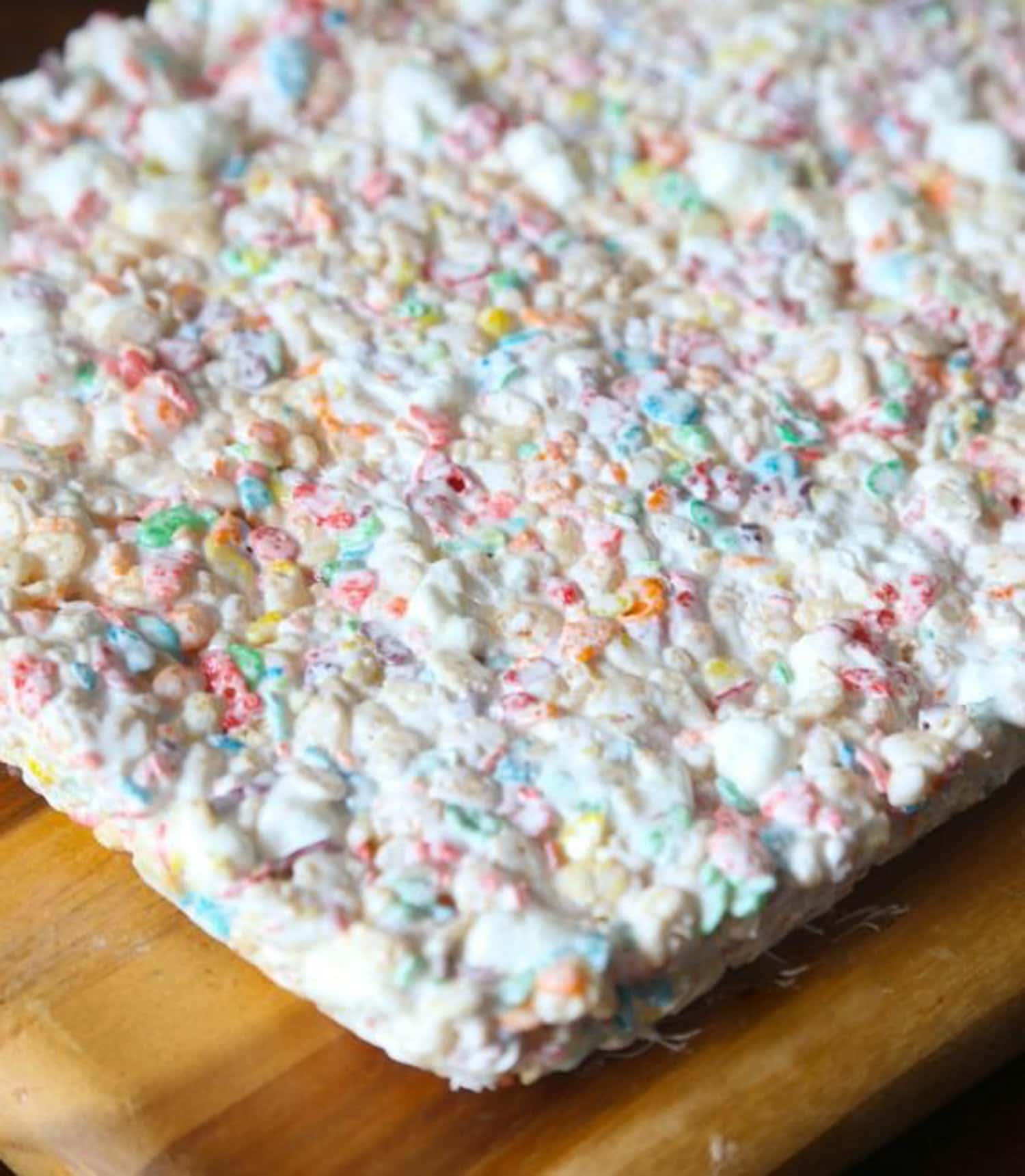 Krispie Treats made with Fluff and mini marshmallows on a cutting board