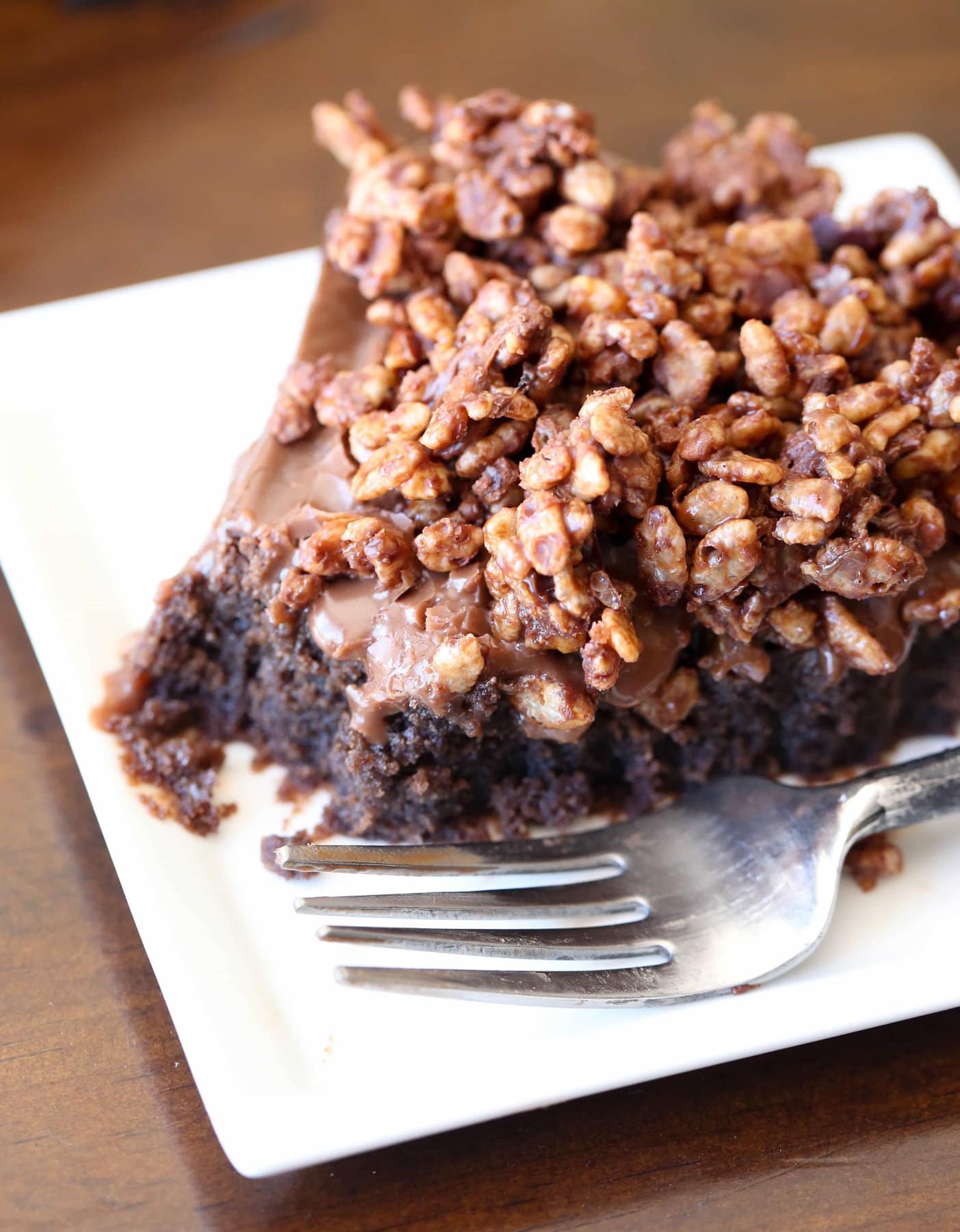 Slice of Nutella cake with Nutella topping and crunch.