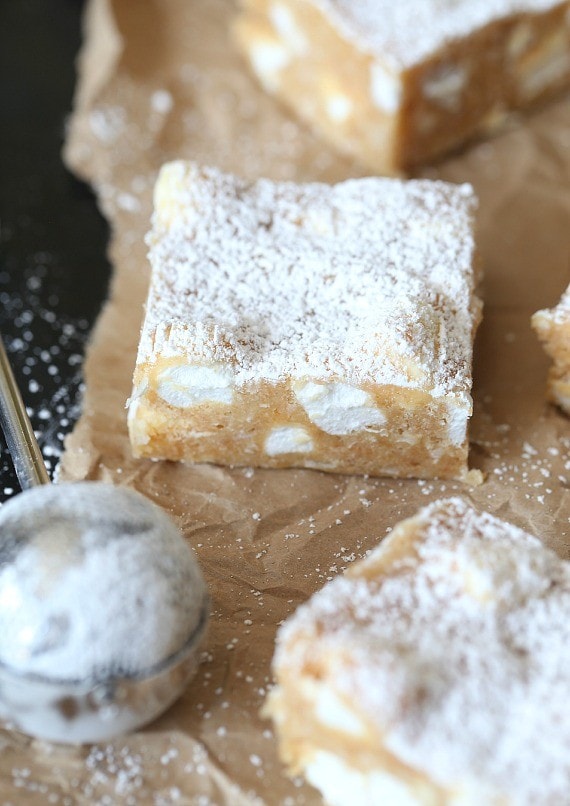 These NO Bake "Snow Drift Bars" are a delicious combination of a custard base mixed with crushed Nilla Wafers, coconut and marshmallows! They are so pretty, buttery and sweet!