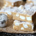 These NO Bake "Snow Drift Bars" are a delicious combination of a custard base mixed with crushed Nilla Wafers, coconut and marshmallows! They are so pretty, buttery and sweet!