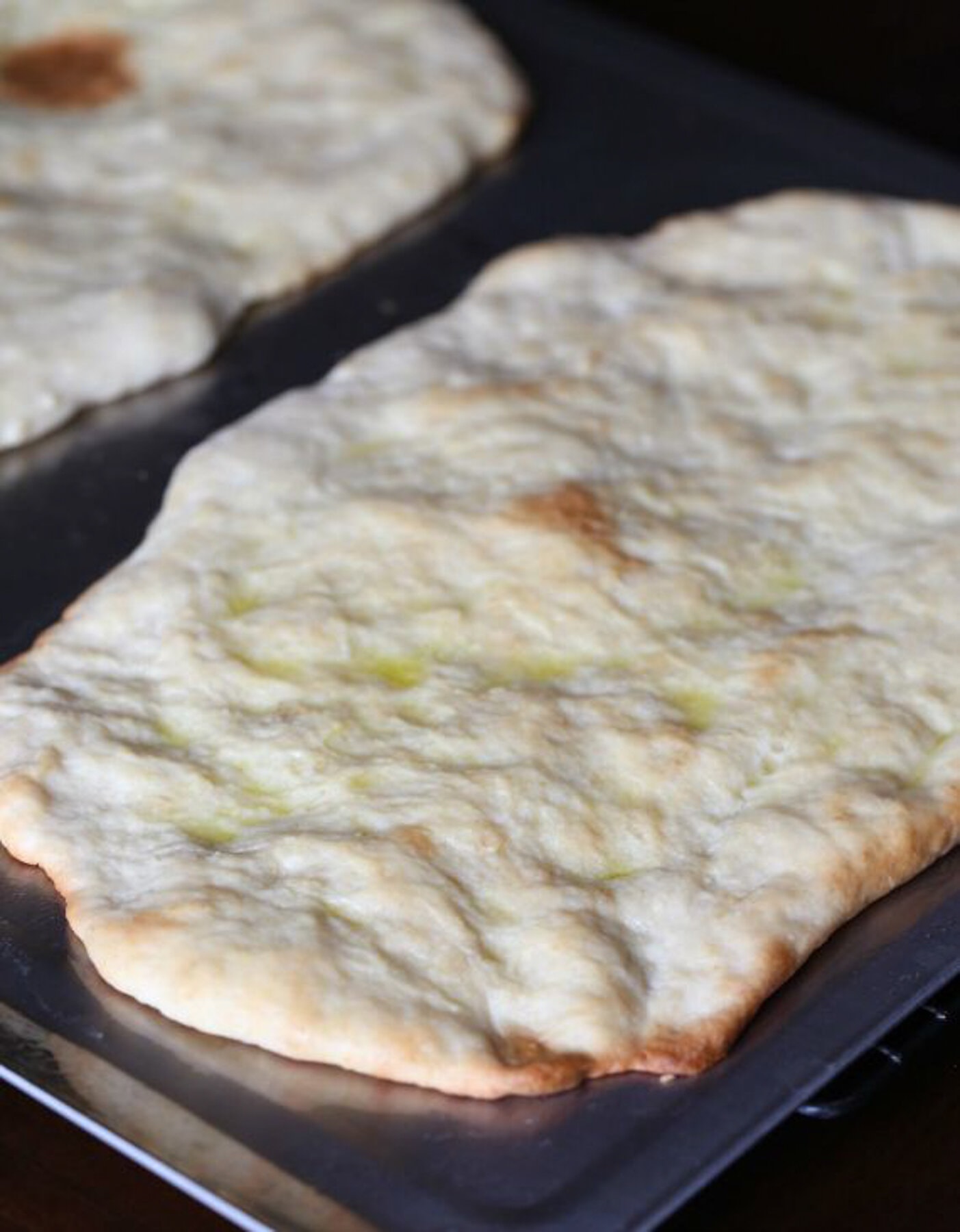 Baked Pizza crust on a sheet pan
