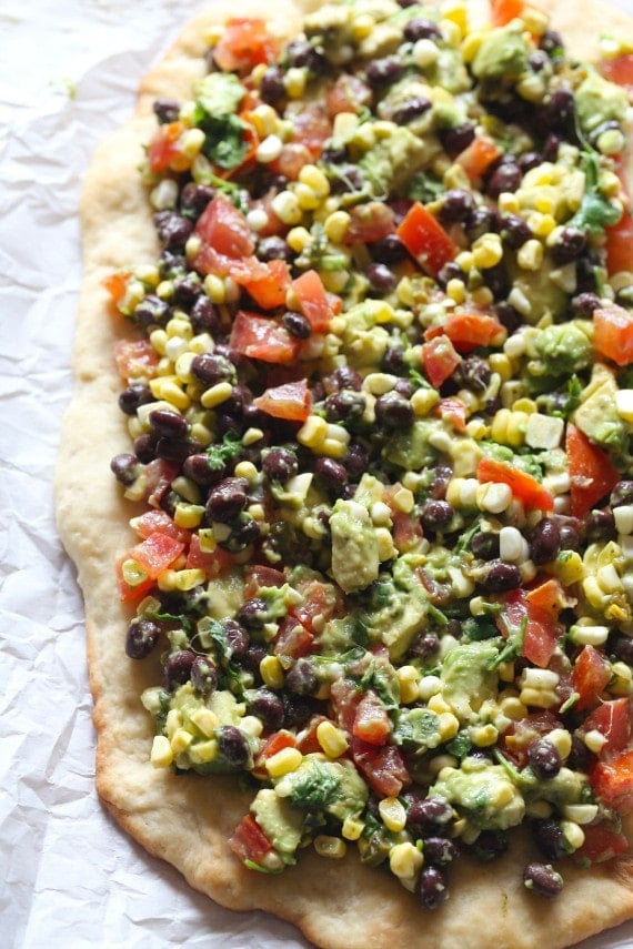 Overhead view of Cowboy Caviar Pizza on parchment paper