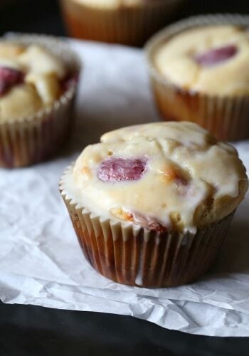 Moist white chocolate raspberry muffins dipped in glaze.