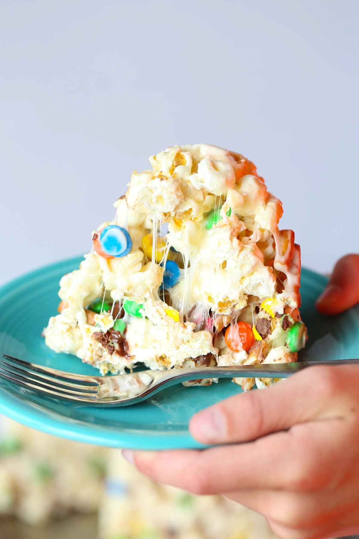 This Popcorn Cake is chewy, gooey, sweet and totally over the top! It's such a simple and fun alternative for a party cake!
