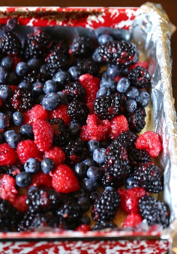 These soft Glazed Berry Sugar Bars are bursting with summer berry flavors! The cookie is soft and buttery, the berries are sweet and flavorful and it's all topped with a creamy sugar glaze!