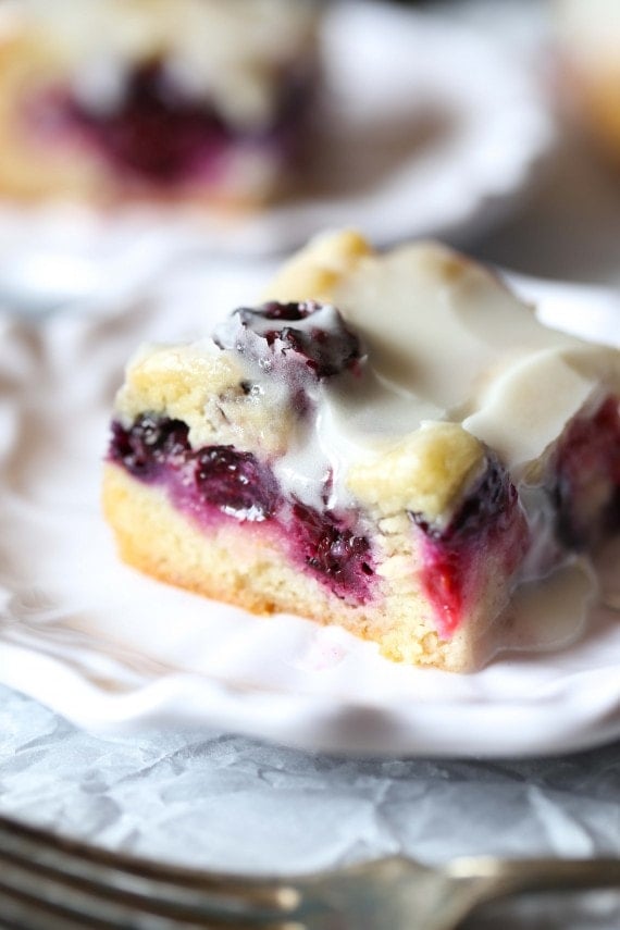 These soft Glazed Berry Sugar Bars are bursting with summer berry flavors! The cookie is soft and buttery, the berries are sweet and flavorful and it's all topped with a creamy sugar glaze!