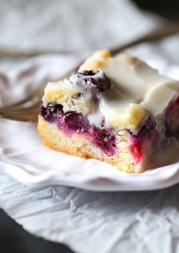 These soft Glazed Berry Sugar Bars are bursting with summer berry flavors! The cookie is soft and buttery, the berries are sweet and flavorful and it's all topped with a creamy sugar glaze!