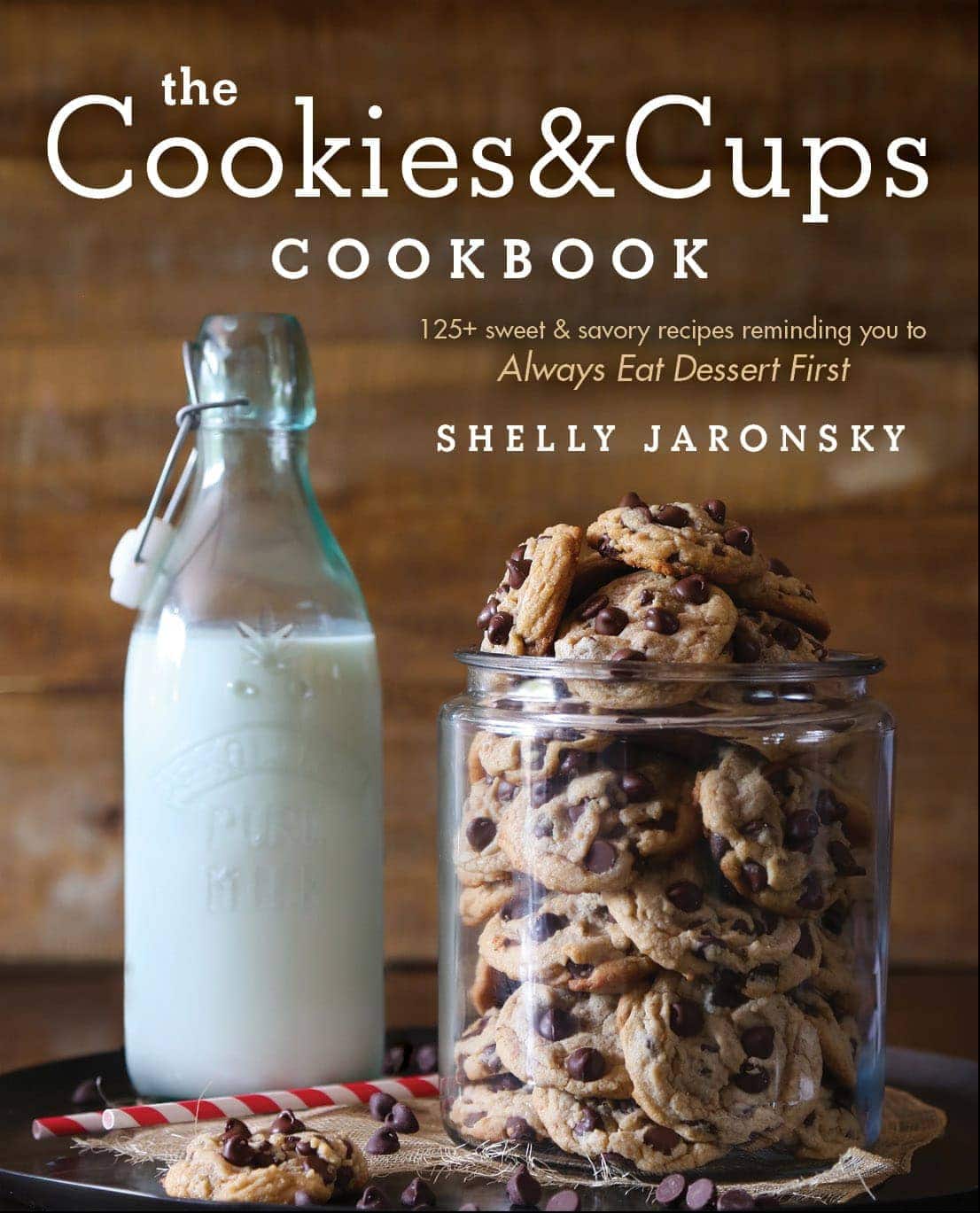 A Jar of Homemade Chocolate Chip Cookies Beside an Old-Fashioned Glass of Milk