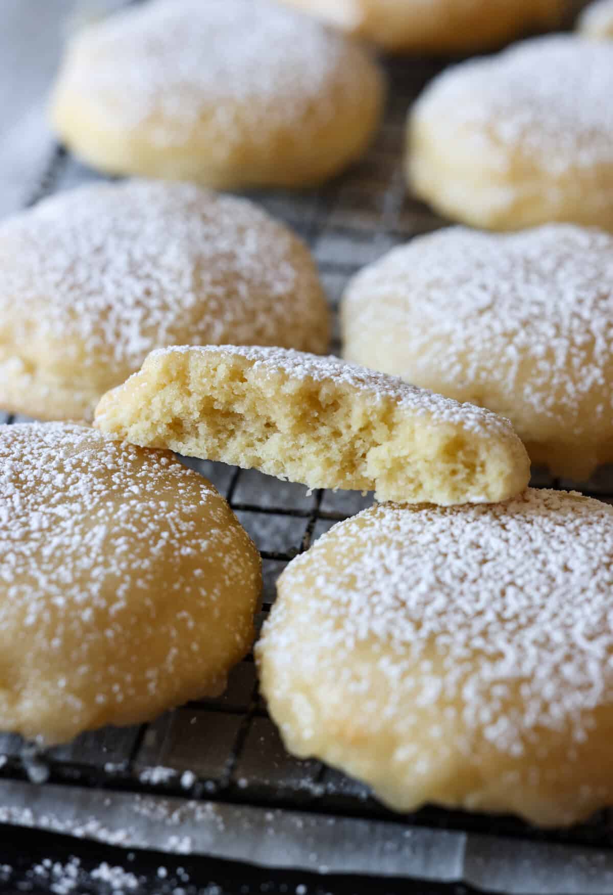 A broken in half Kentucky Butter Cake Cookie stacked on a cooling rack.